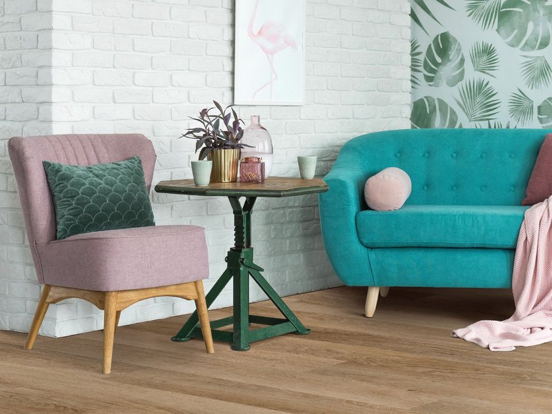 living room with pink chair and teal couch - LMK Floors in Colville, WA