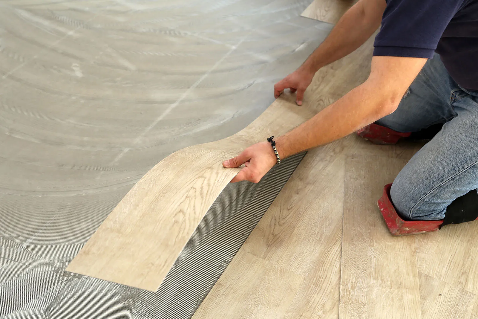 Man installing vinyl | LMK Floors